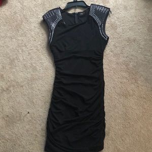 Black tight dress with studs on the shoulders